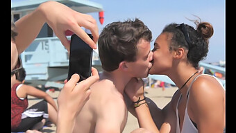 Black And White Couples Exchange Passionate Kisses On The Beach